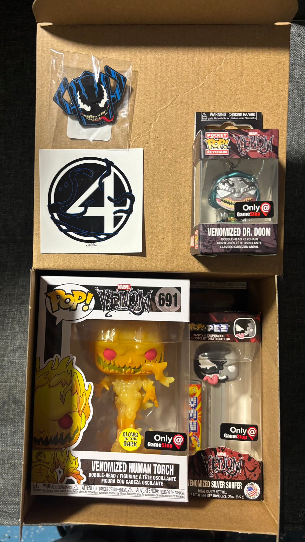 Venomized Human Torch #691 (GITD) (mystery box)