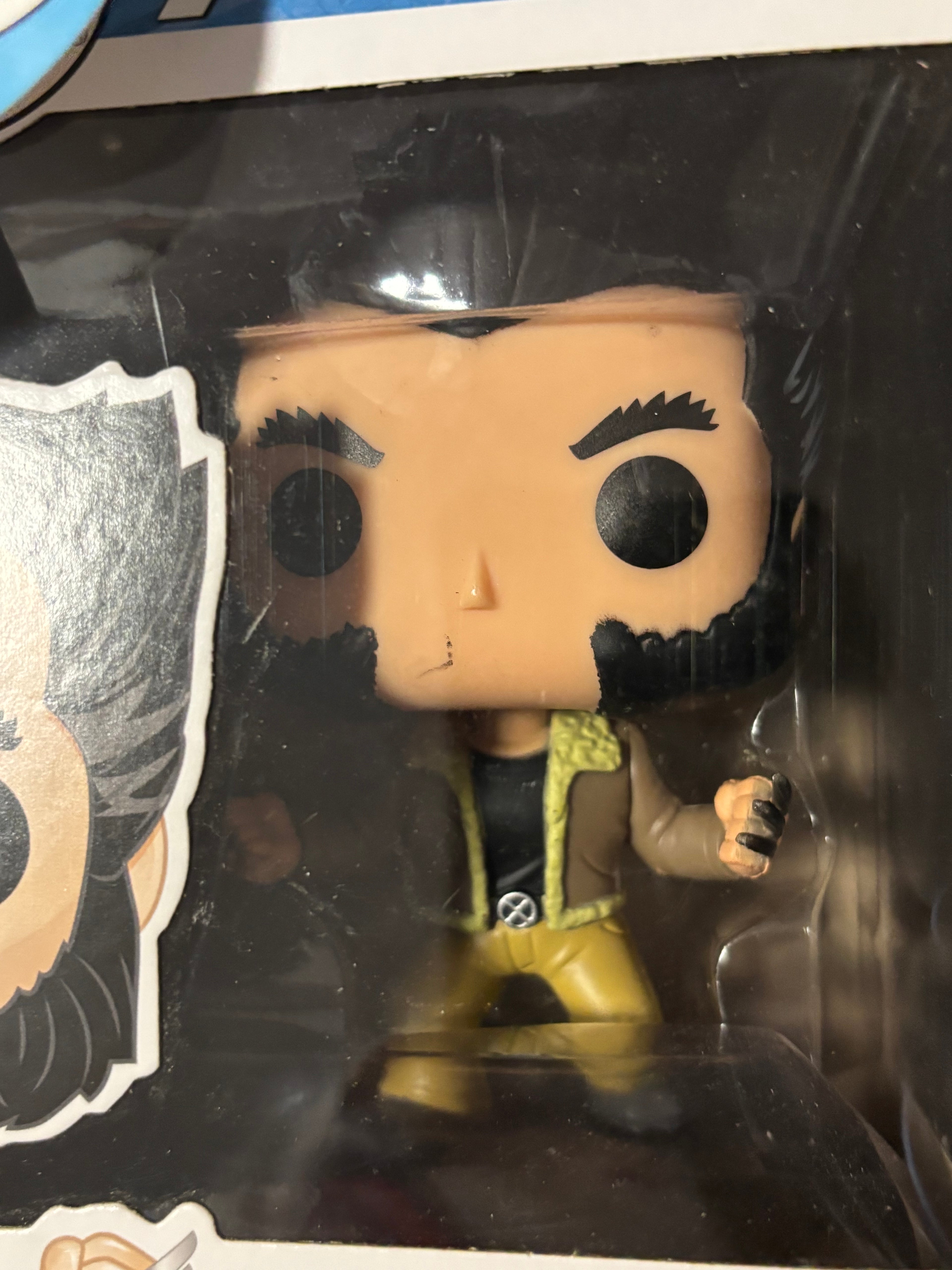 Logan (Wolverine) (checks photos box n paint on face).