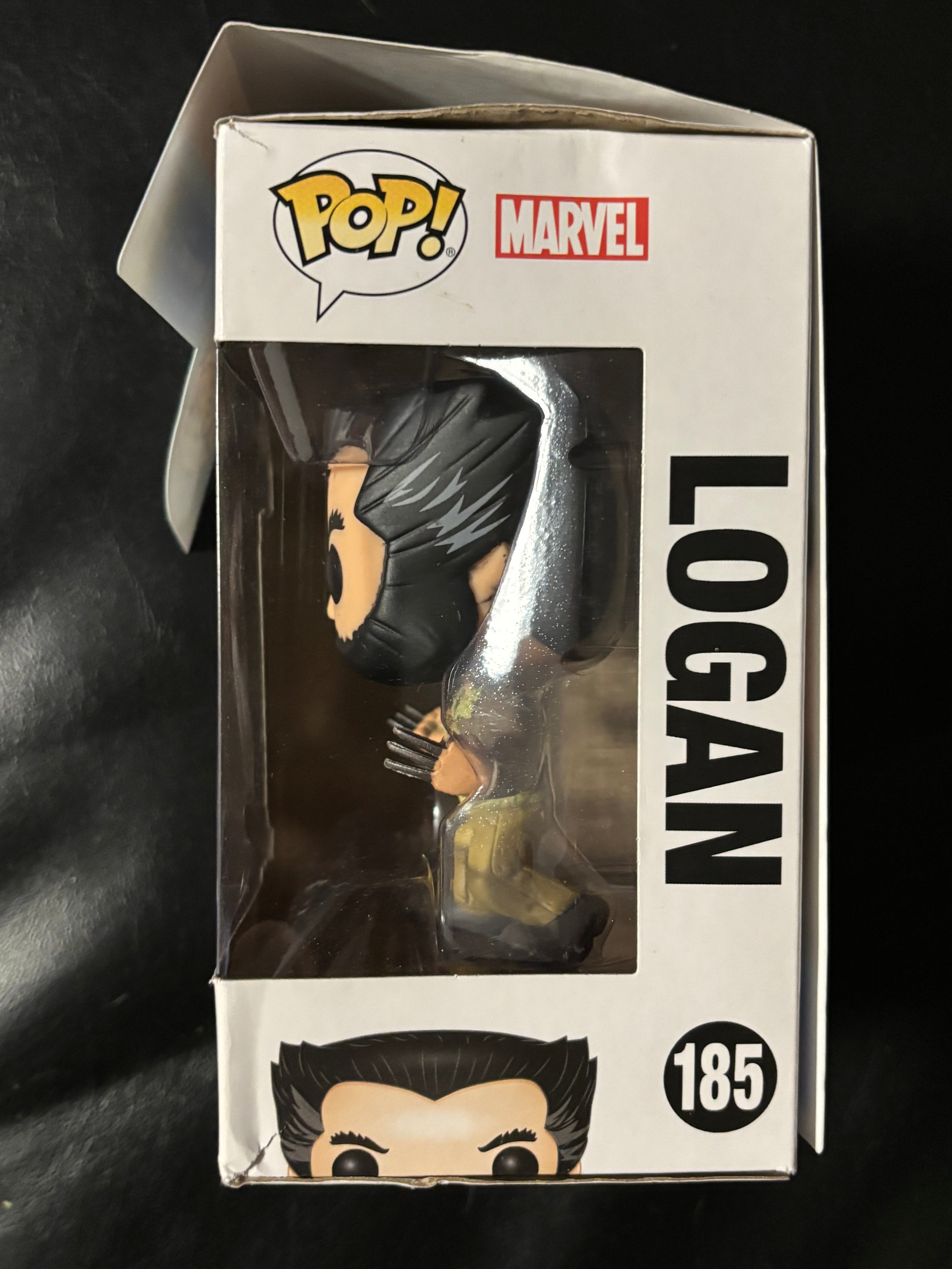 Logan (Wolverine) (checks photos box n paint on face).